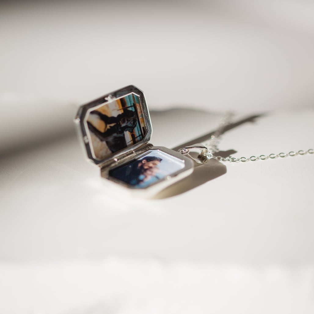 the rainbow locket with two pictures inside